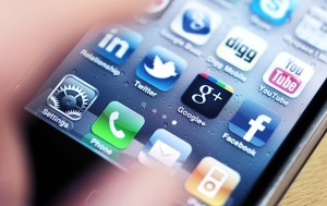 bigstock-Apple-iPhone-with-Social-Media-22890494