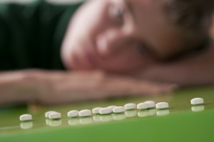 bigstock-Teenage-boy-and-pills-27553064