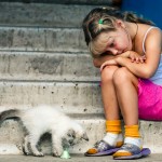 bigstockphoto_Sitting_Girl_And_Cat_3565758